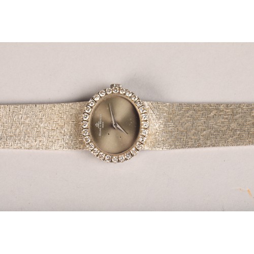 130 - Ladies Baume and Mercier 18 carat white gold wrist watch, with oval dial, diamond encrusted dial, wi... 