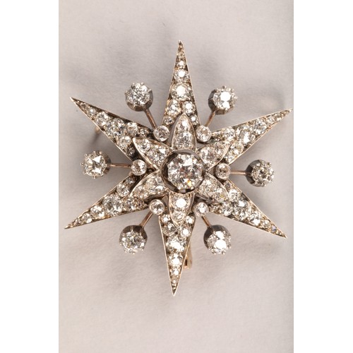 40 - Victorian diamond encrusted star burst brooch, central diamond 0.75 carat, mounted on white metal wi... 