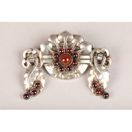 109 - Georg Jensen silver brooch number 9, set with garnet and carnelian decorated with stylised embossed ... 