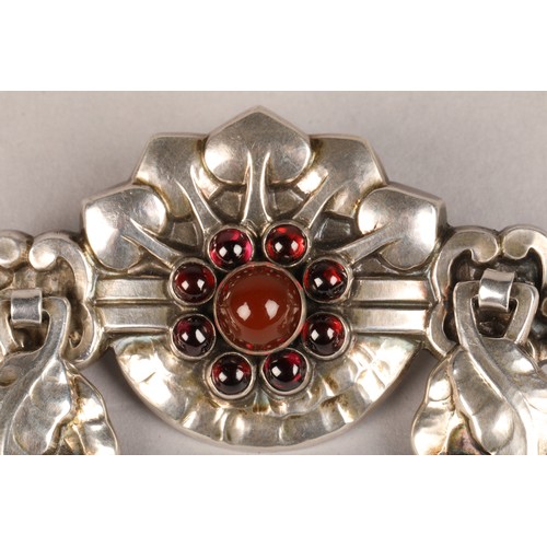 109 - Georg Jensen silver brooch number 9, set with garnet and carnelian decorated with stylised embossed ... 