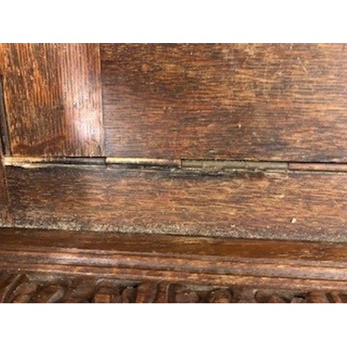 558 - Victorian carved oak settle/monks bench, with carved figure panelled back above, lift up seat flanke... 