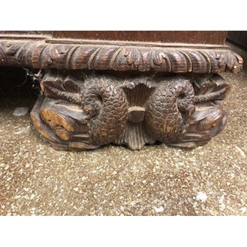 558 - Victorian carved oak settle/monks bench, with carved figure panelled back above, lift up seat flanke... 