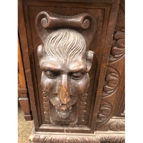 558 - Victorian carved oak settle/monks bench, with carved figure panelled back above, lift up seat flanke... 