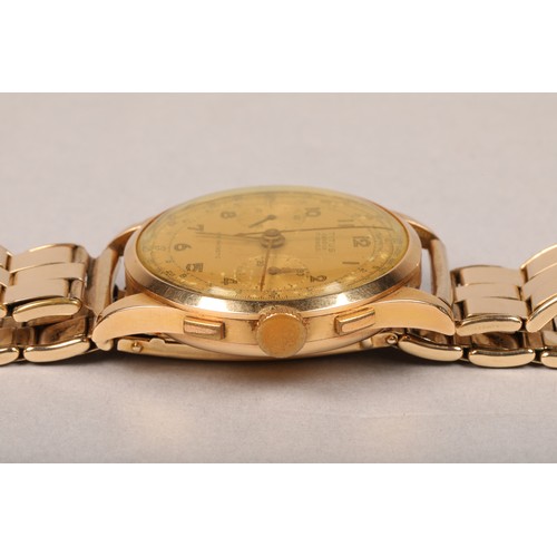 128 - Gents 18 carat gold Titus Chronograph wrist watch on a rolled gold strap