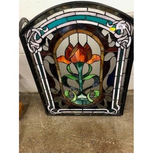 573 - Stained glass triptych folding fire screen, decorated with three stylised panels of flowers, length ... 