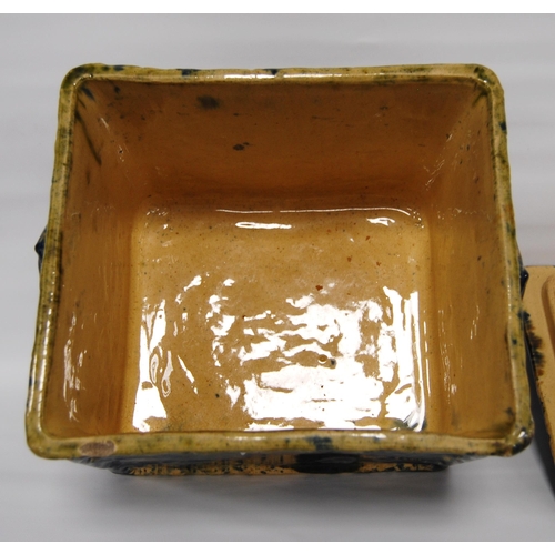 226 - Scottish pottery bread bin and cover of rectangular shape glazed in mottled colours, 23cm high.