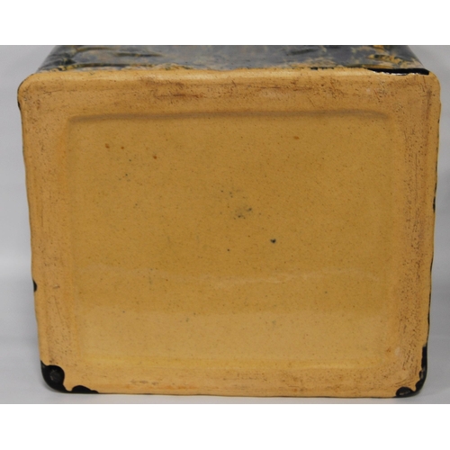 226 - Scottish pottery bread bin and cover of rectangular shape glazed in mottled colours, 23cm high.