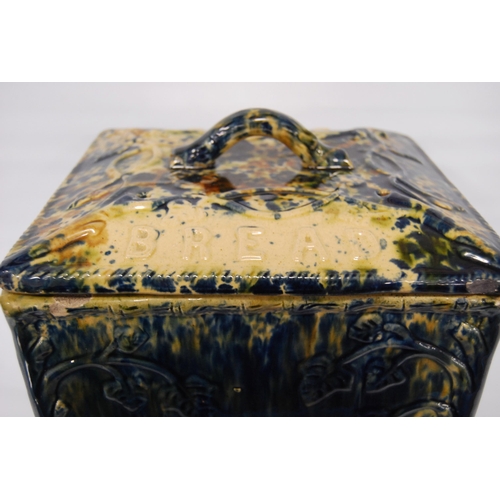 226 - Scottish pottery bread bin and cover of rectangular shape glazed in mottled colours, 23cm high.