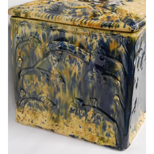 226 - Scottish pottery bread bin and cover of rectangular shape glazed in mottled colours, 23cm high.