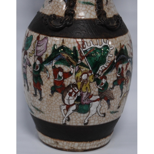 263 - Chinese crackle glazed vase (20th century) decorated with a battle scene in polychrome enamels, with... 