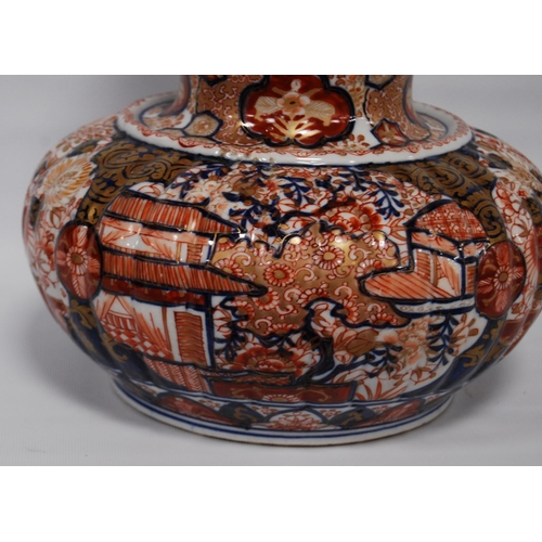 264 - Oriental Imari vase of bulbous form decorated all over with floral panels and blossoming trees in a ... 