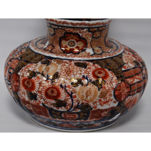 264 - Oriental Imari vase of bulbous form decorated all over with floral panels and blossoming trees in a ... 