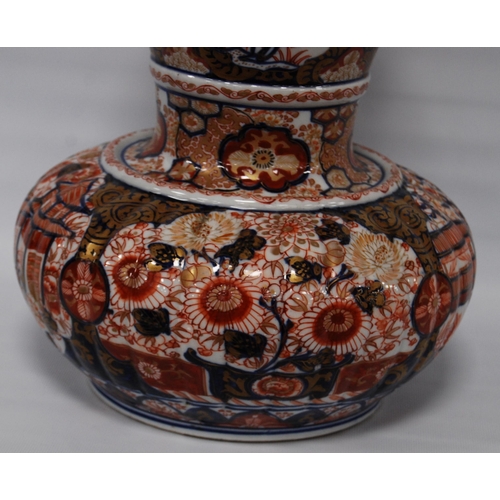 264 - Oriental Imari vase of bulbous form decorated all over with floral panels and blossoming trees in a ... 