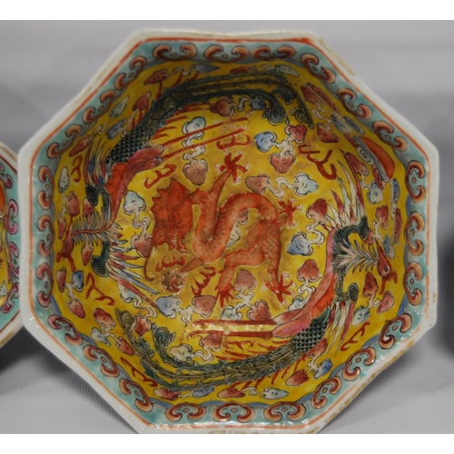 265 - Three Chinese porcelain Qianlong (1711 - 1799) famille rose octagonal bowls, red seal mark to the tu... 