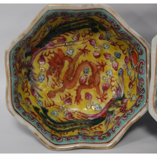 265 - Three Chinese porcelain Qianlong (1711 - 1799) famille rose octagonal bowls, red seal mark to the tu... 