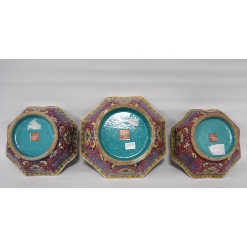 265 - Three Chinese porcelain Qianlong (1711 - 1799) famille rose octagonal bowls, red seal mark to the tu... 