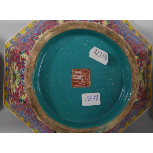 265 - Three Chinese porcelain Qianlong (1711 - 1799) famille rose octagonal bowls, red seal mark to the tu... 