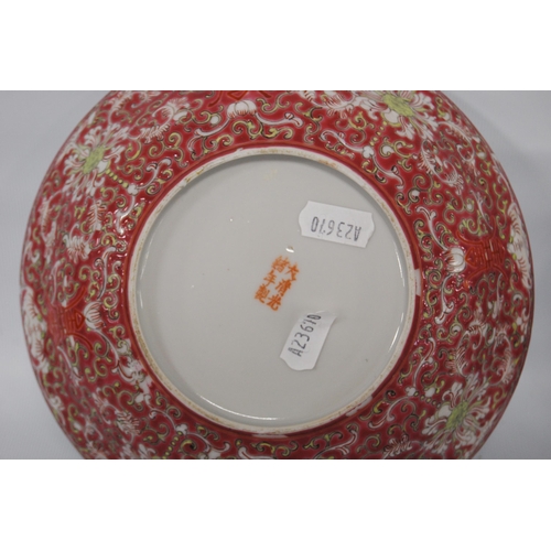 266 - Two near-matching Chinese famille rose porcelain bowls, decorated all over with ruyi, floral panels ... 