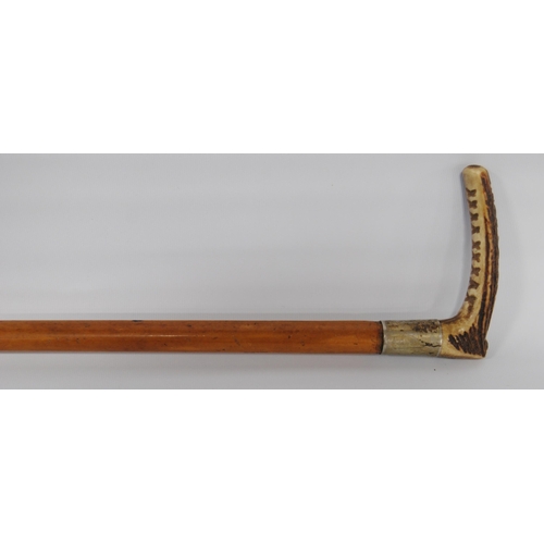 196 - Two George VI period riding crops by Swaine & Adeney, London, both with maker's button to the an... 