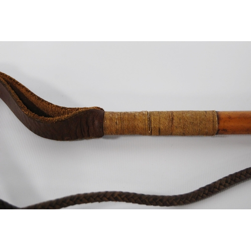 196 - Two George VI period riding crops by Swaine & Adeney, London, both with maker's button to the an... 