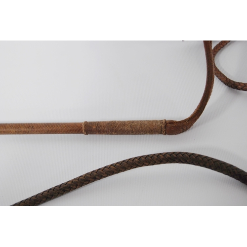 196 - Two George VI period riding crops by Swaine & Adeney, London, both with maker's button to the an... 