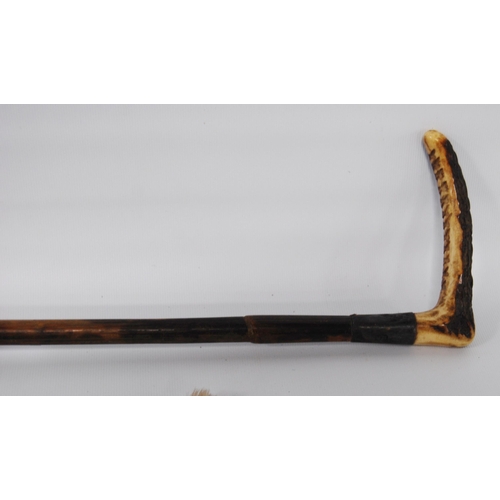 197 - Two George VI period riding crops, both with antler handles above a silver and white metal collar, b... 