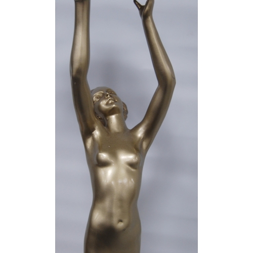 174 - Art Deco painted table lamp, c. 1930s, modelled as a nude female holding aloft a later mottled spher... 