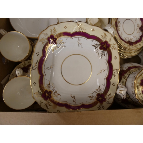 73 - 19th century part tea set decorated with gilt and red ornamentation.