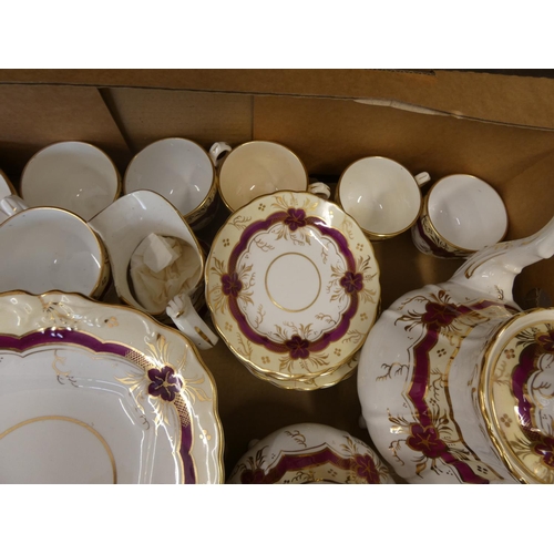 73 - 19th century part tea set decorated with gilt and red ornamentation.