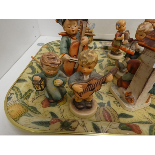 25 - Group of ten Hummel figures by Goebel.