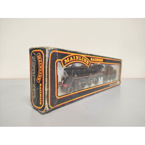 148 - Boxed model railway locomotives and carriages to include a Mainline BR 4-6-0 Class 4 Locomotive 37-0... 