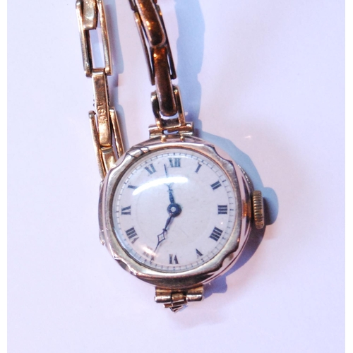 129 - Lady's 9ct gold watch on expanding part-gold bracelet.