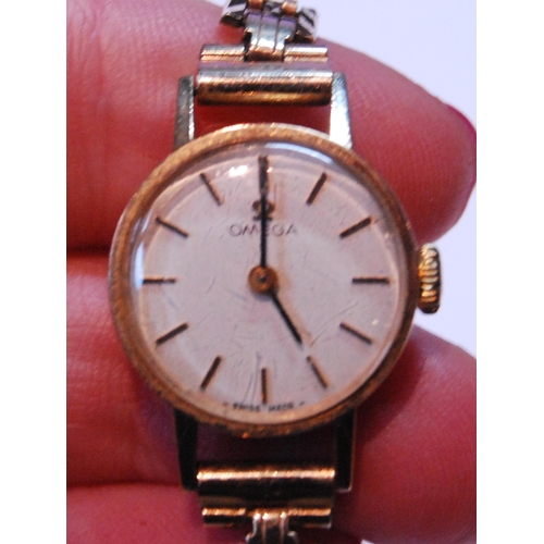 140 - Lady's Omega 9ct gold bracelet watch, 1982, 14g gross.