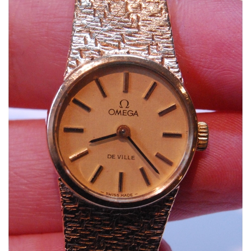 132 - Lady's Omega 9ct gold bracelet watch, 1973, two spare links, 30g gross.