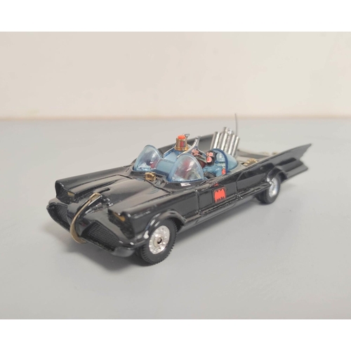 13 - Corgi Toys. Boxed Corgi 267 Batmobile with 12 un-used missiles, both figures present.... 