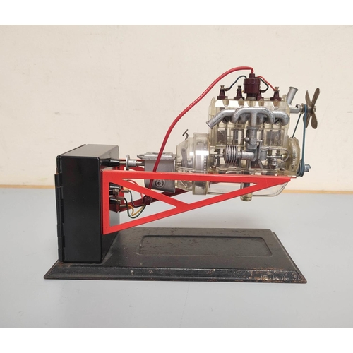 22 - 1950s German Gescha battery operated transparent 4-cylinder model engine.