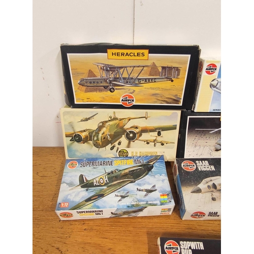 23 - Eleven Airfix boxed model airplanes to include Supermarine Spitfire MK1 01071, H.P Hampden 491, Horm... 