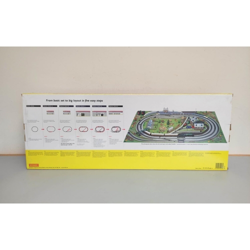 152 - Hornby. 00 Gauge boxed Eurostar Set no R1013 and a 00 gauge track pack system R8017. (2)... 