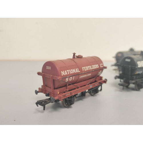 160 - Box of 00 gauge model train rolling stock, track and scenery to include nine examples by Bachmann to... 