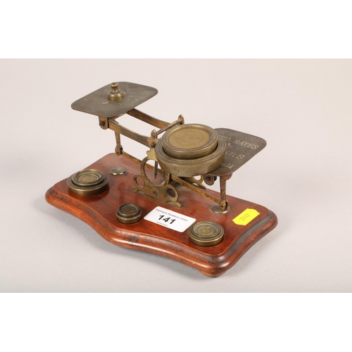 141 - Set of postal rate scales with weights