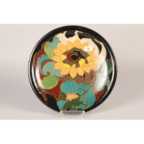 175 - Gouda pottery wall charger, decorated with stylised flowers, LHZON 424 Arnhem Holland, diameter 41cm
