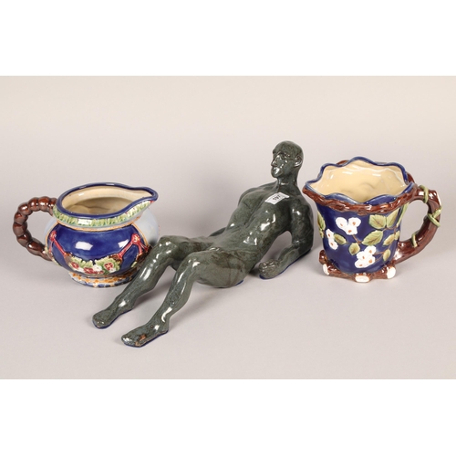 197 - G Horsfield 'Oscar' male nude reclining, ceramic sculpture with Two Majolica jugs (3)
