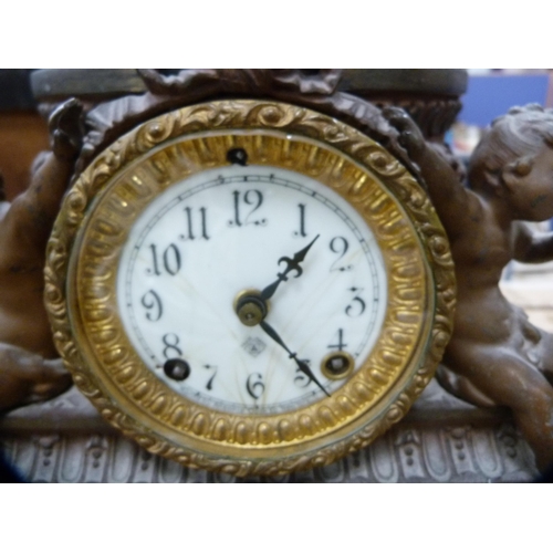 121 - Continental spelter clock surmounted by a figure.