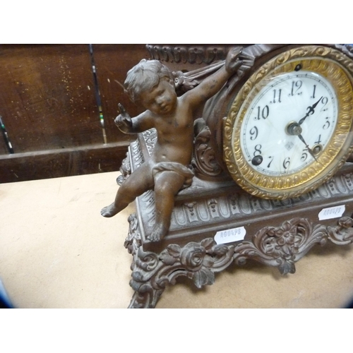 121 - Continental spelter clock surmounted by a figure.