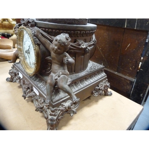 121 - Continental spelter clock surmounted by a figure.