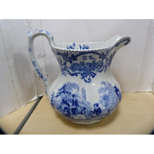 13 - Blue and white 'Willow' pattern ashet, Mason's blue and white jug and three others.