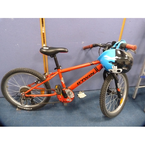 130 - Child's B-Twin mountain bike and helmet.