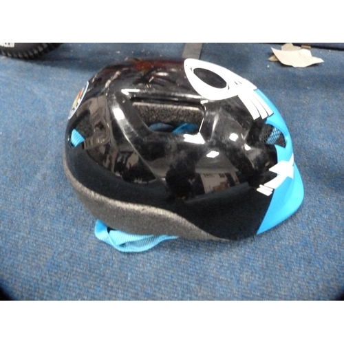 130 - Child's B-Twin mountain bike and helmet.