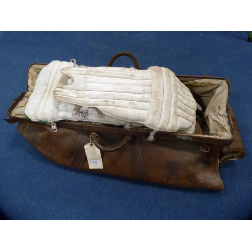 132 - Quantity of cricket pads, some marked for Harrods, contained in a large Gladstone-type bag.