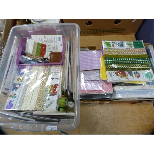 137 - Two cartons containing assorted craft items to include rubber stamps, scrapbooking supplies, card to... 